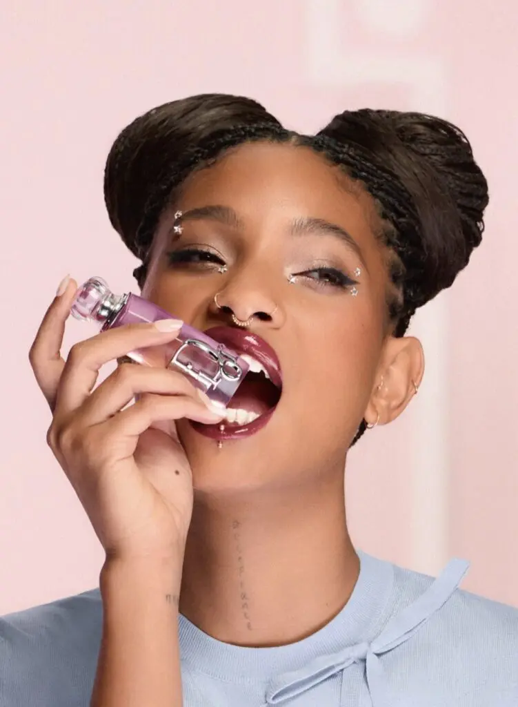 Dior Addict campaign portrait with glossy lips holding product
