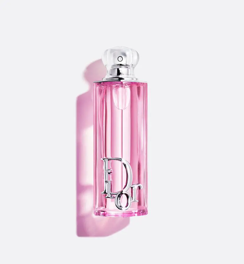 Dior Addict fragrance bottle on white background with pink shadow
