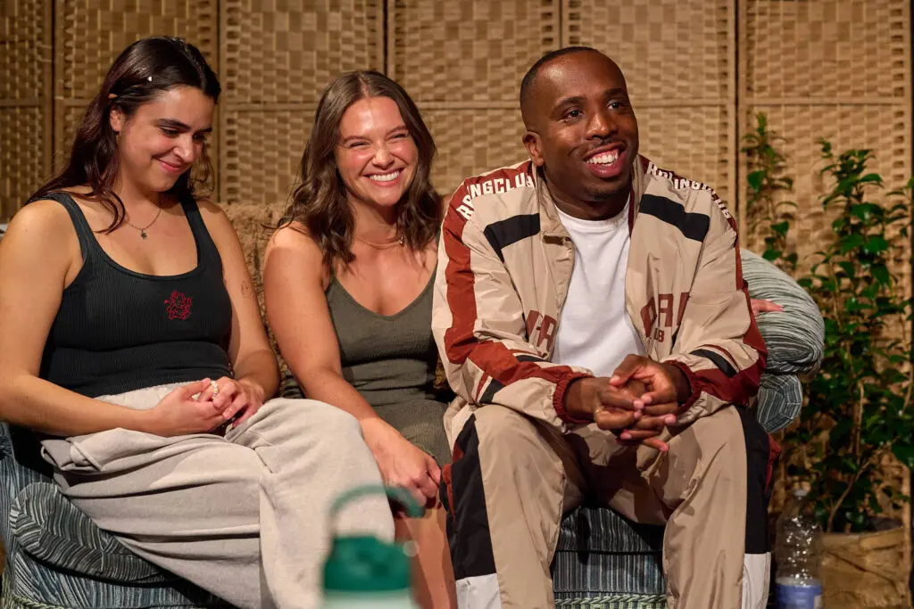 Talking People cast seated together on stage