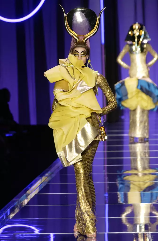 Adina Fohlin walks in Dior’s 2004 couture show in a hieroglyph-embellished look