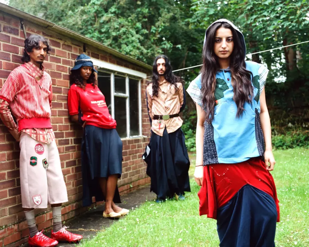 Four models in sporty, culturally hybrid looks by Tasnim Chowdhury shot outdoors