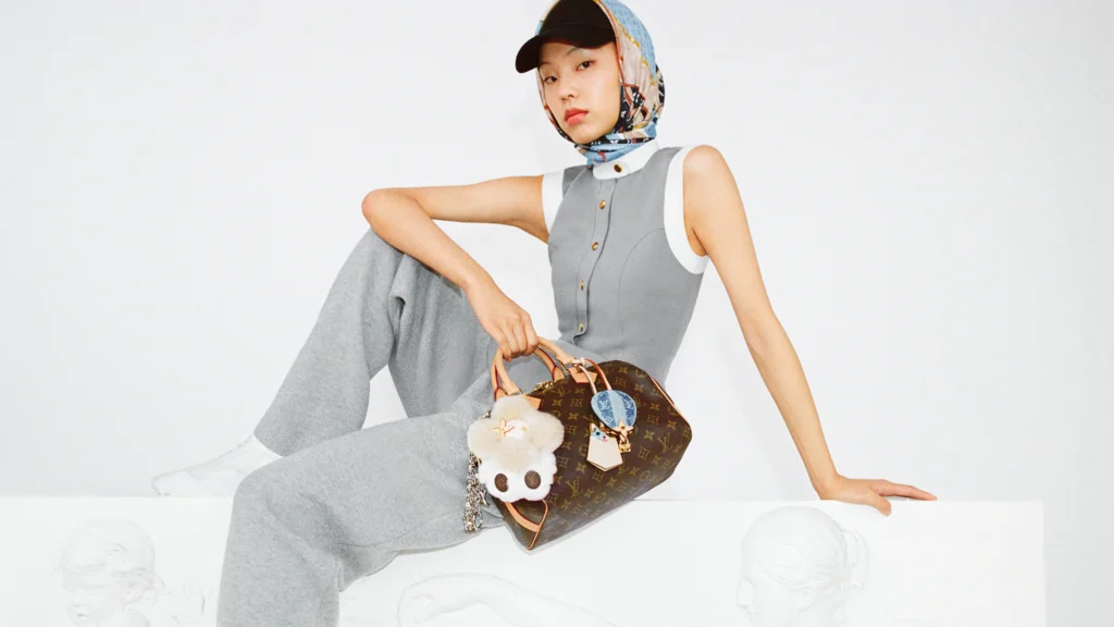 Louis Vuitton bag styled with plush charm