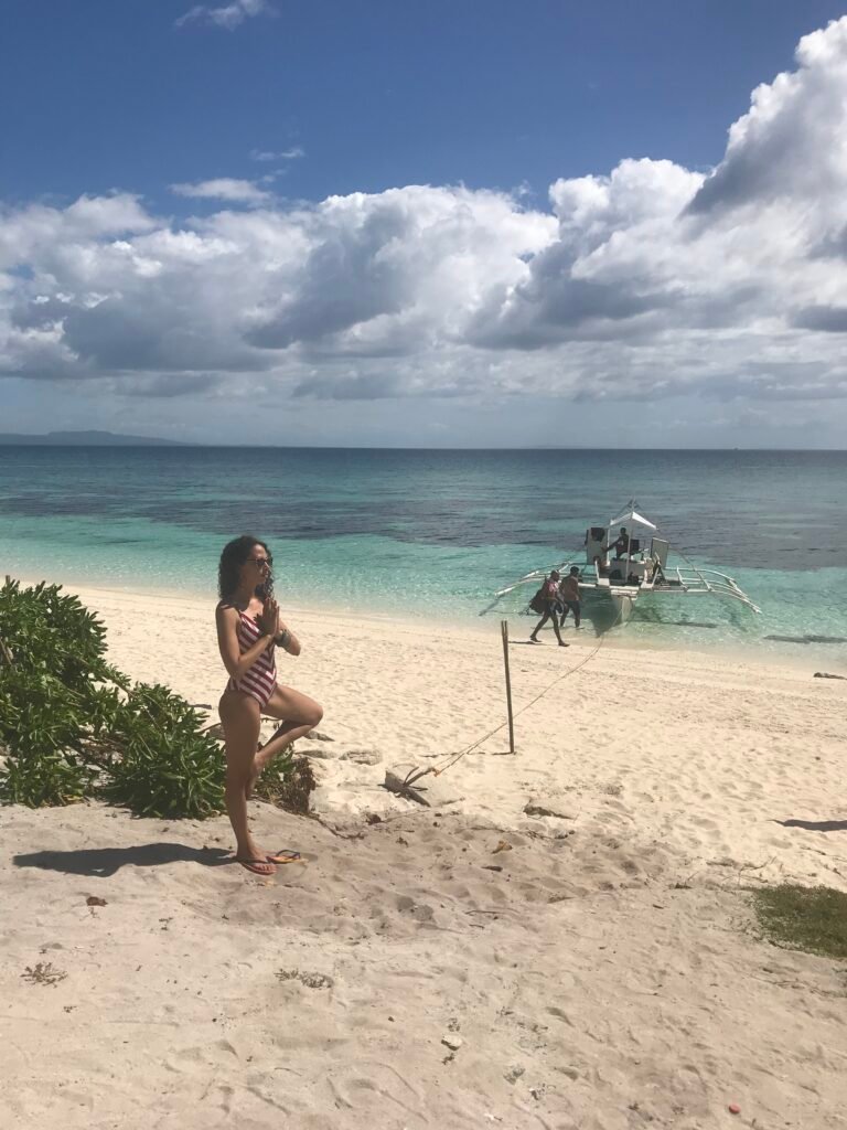 Tree pose on tropical beach for calm and clarity